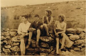 George and John MacMillan with Mary and Anna my two elder sisters about 1948